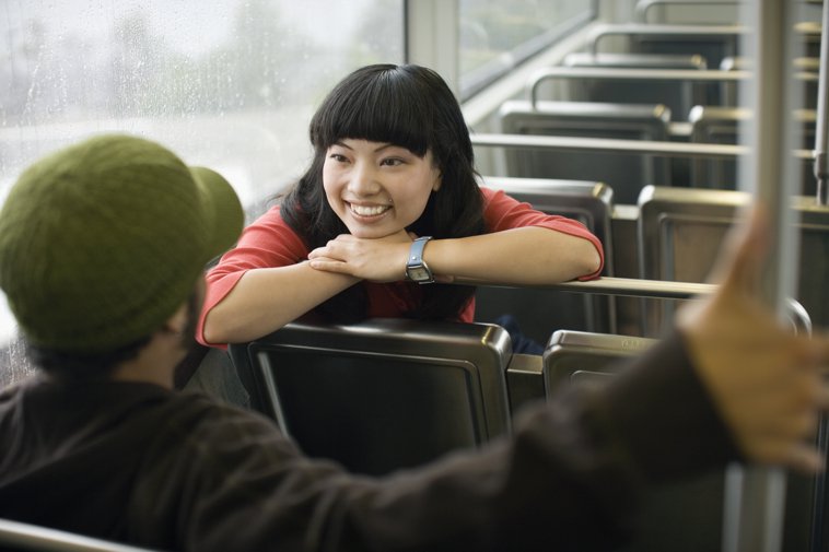 couple chatting on a train